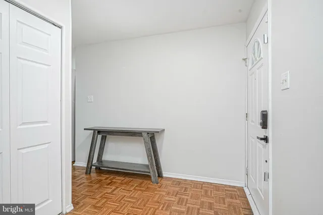 a spacious bedroom with a large bed and a couch