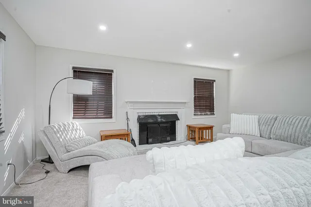 a spacious bedroom with a large bed and a couch