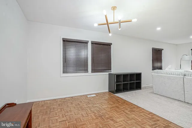 a kitchen with cabinets a sink and a refrigerator