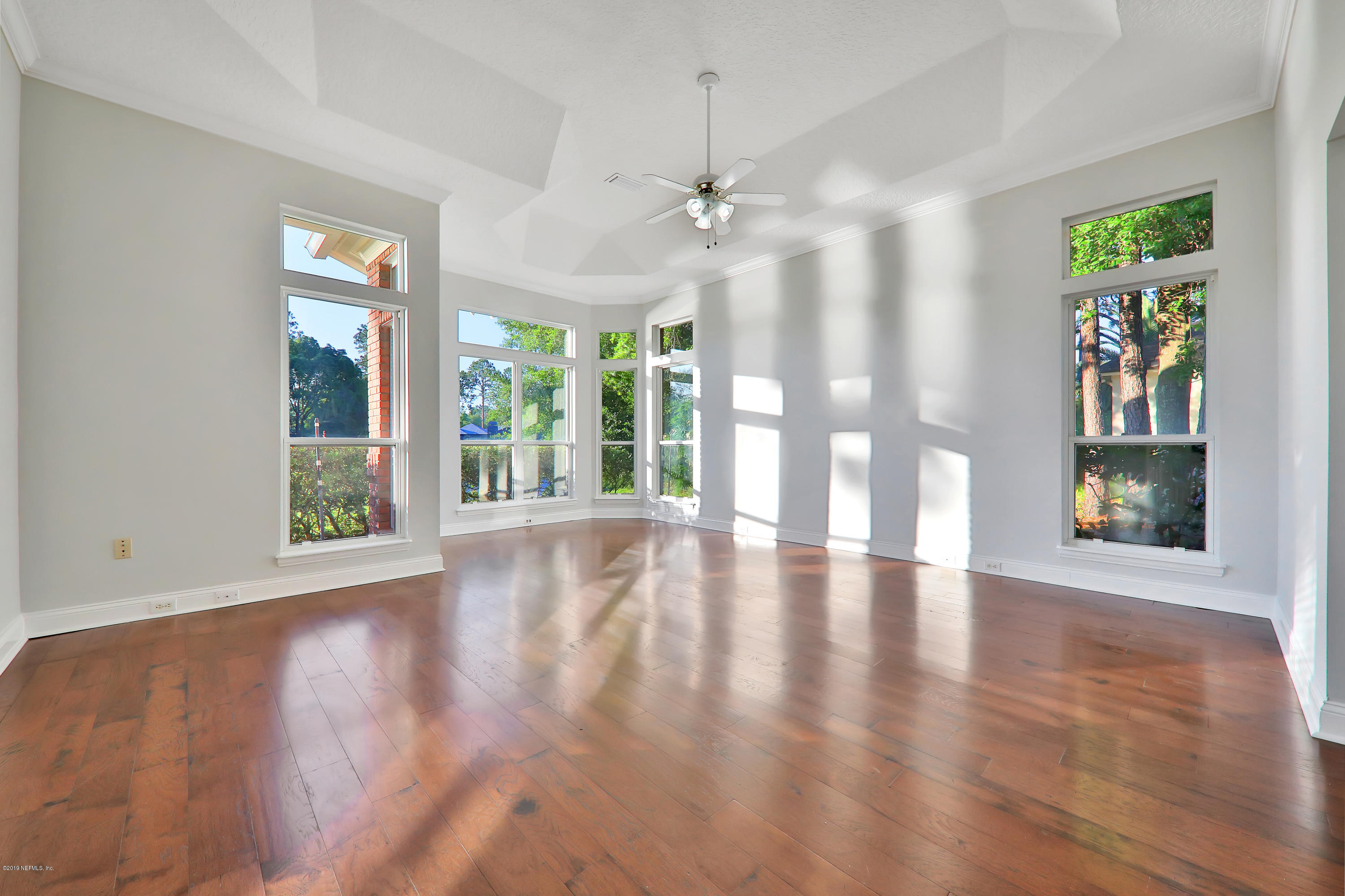 1444 Course View Drive Fleming Island, FL 32003 - Photo 21 of 61 a view of an empty room with window and wooden floor
