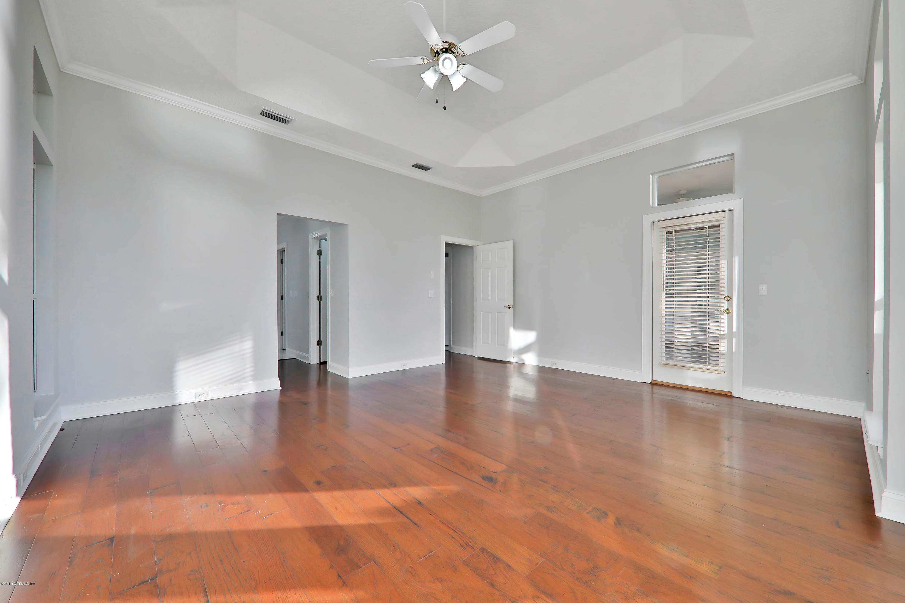 1444 Course View Drive Fleming Island, FL 32003 - Photo 23 of 61 a view of an empty room with window and wooden floor
