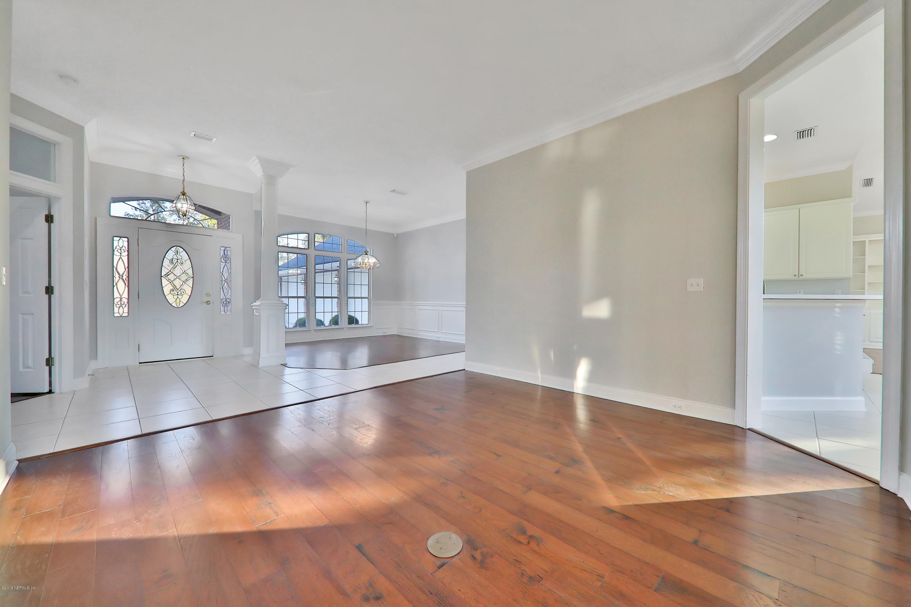 1444 Course View Drive Fleming Island, FL 32003 - Photo 28 of 61 a view of a hallway with wooden floor