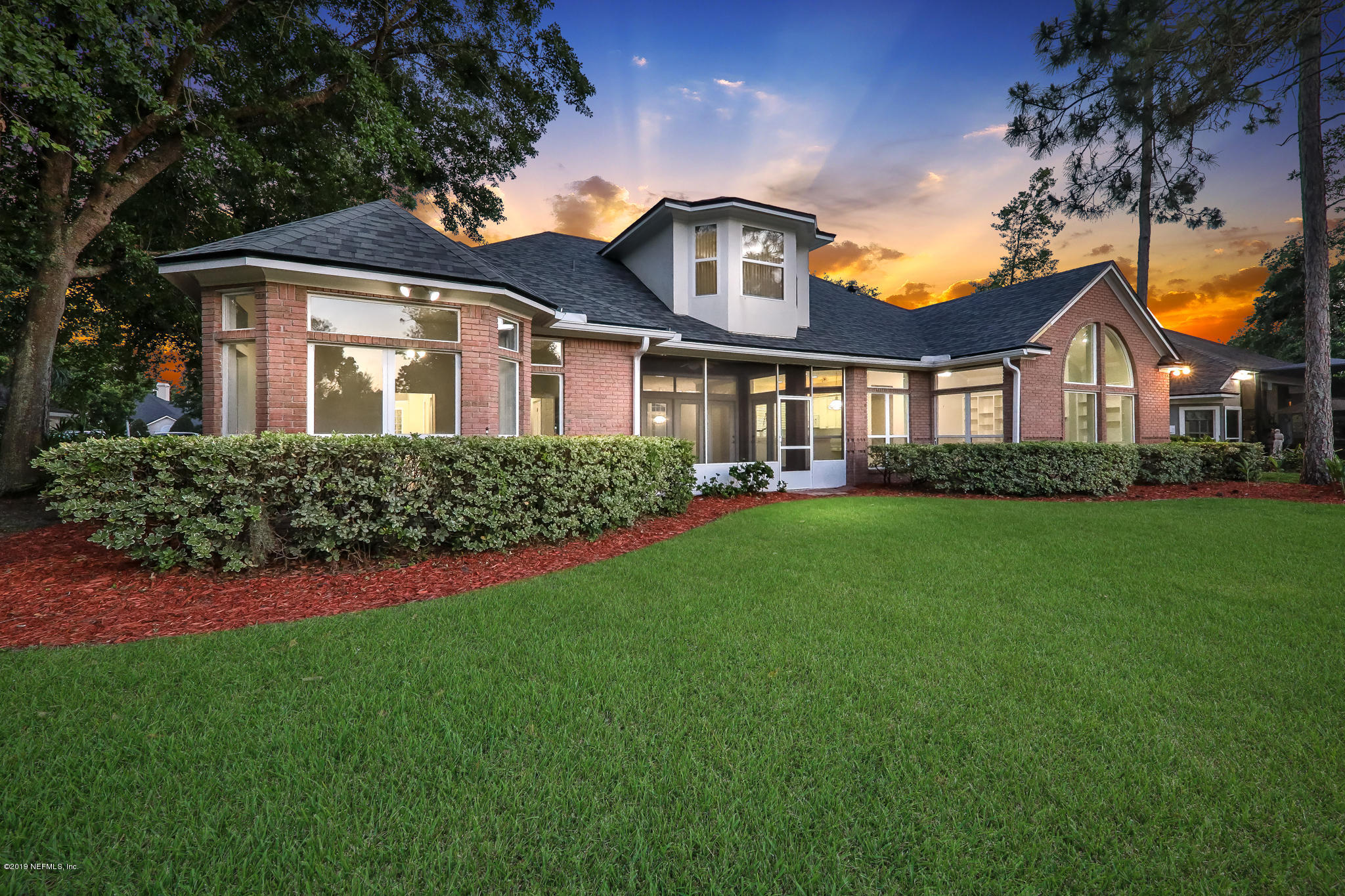 1444 Course View Drive Fleming Island, FL 32003 - Photo 3 of 61 a front view of a house with a garden