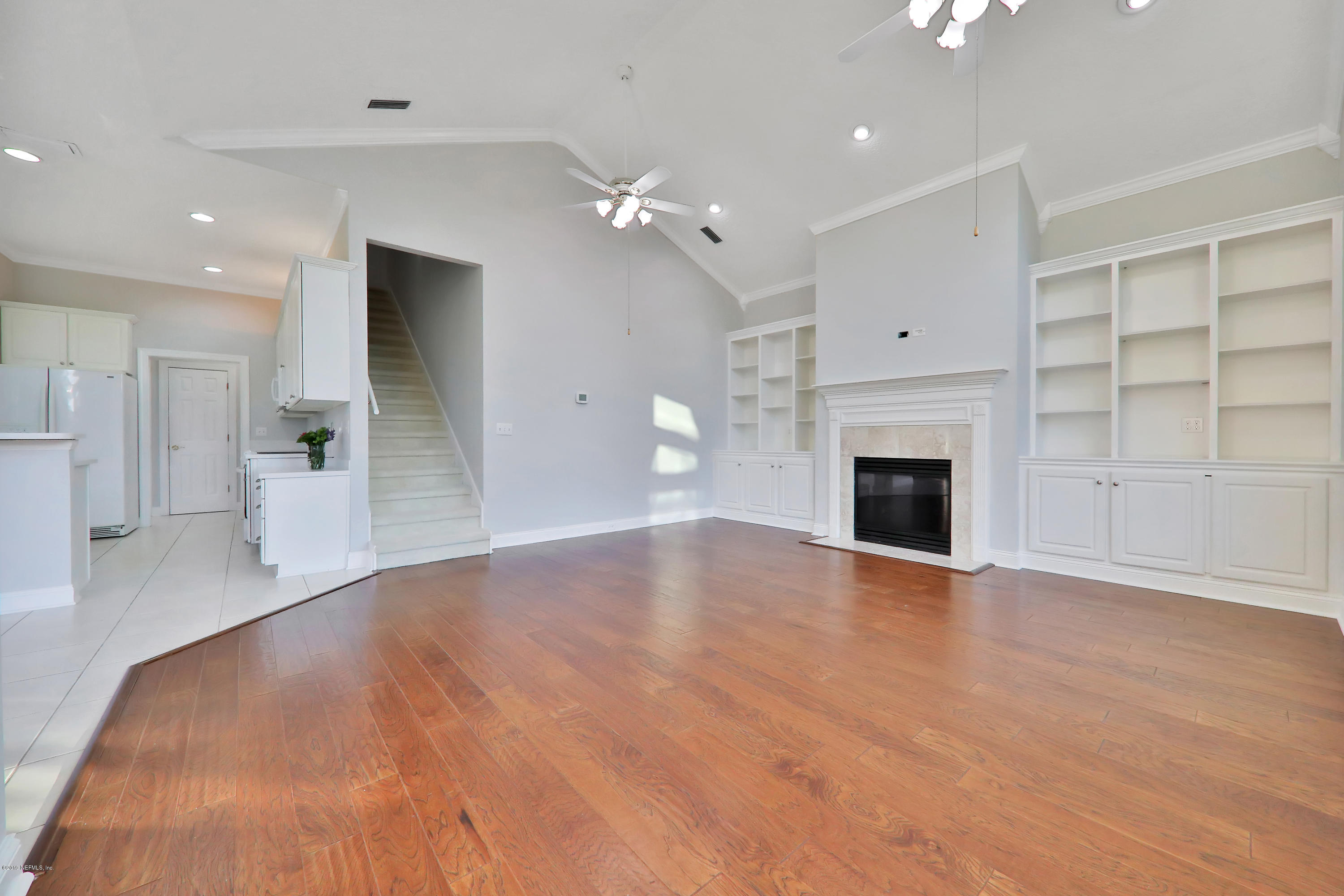 1444 Course View Drive Fleming Island, FL 32003 - Photo 31 of 61 a view of empty room with a fireplace and cabinet