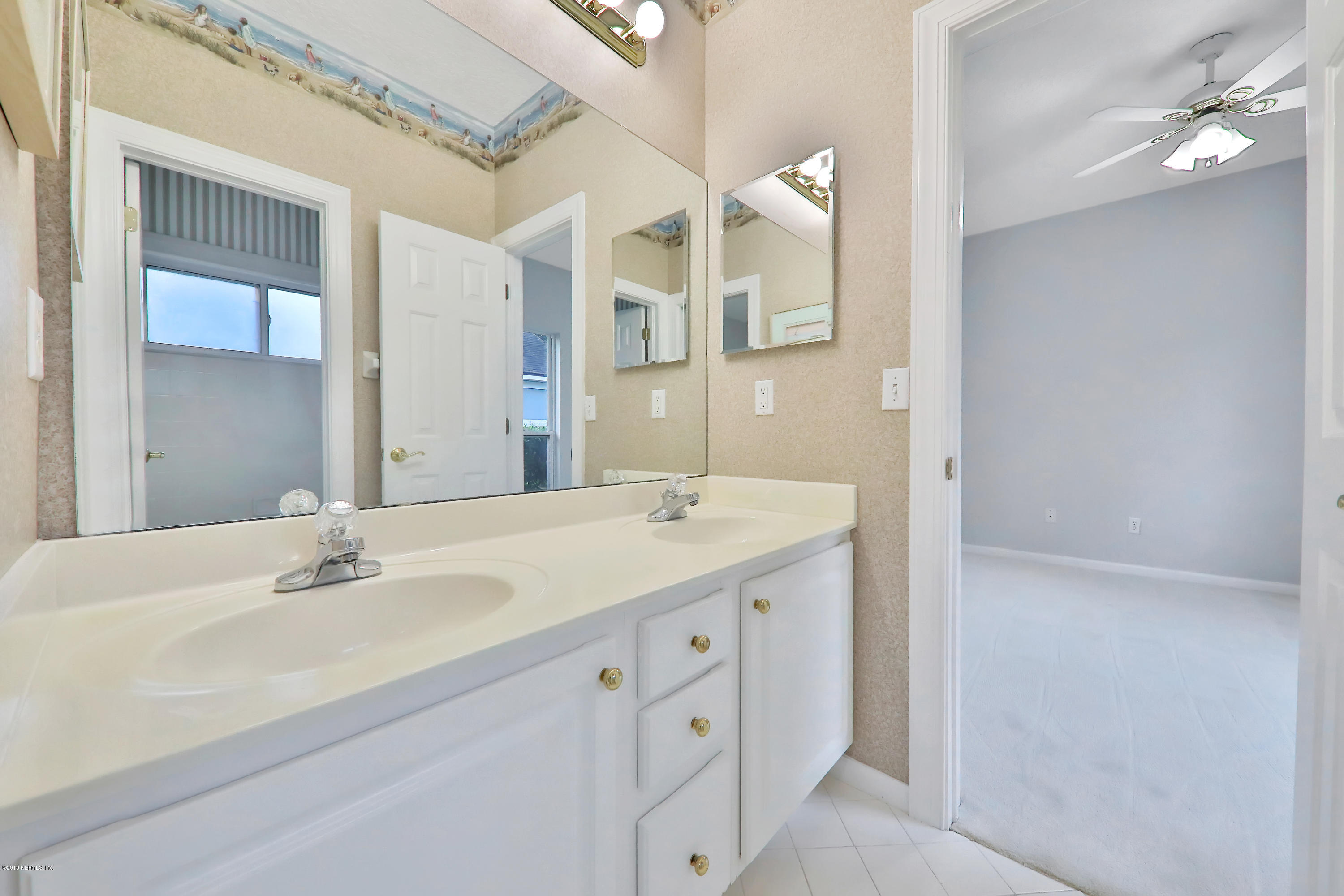 1444 Course View Drive Fleming Island, FL 32003 - Photo 41 of 61 a bathroom with a sink vanity and a mirror