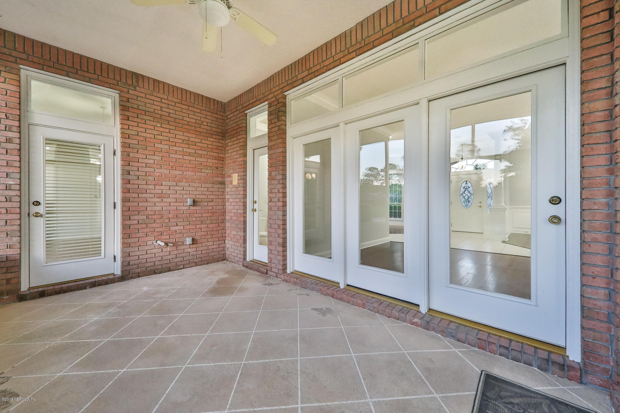 1444 Course View Drive Fleming Island, FL 32003 - Photo 47 of 61 a view of an empty room with glass door