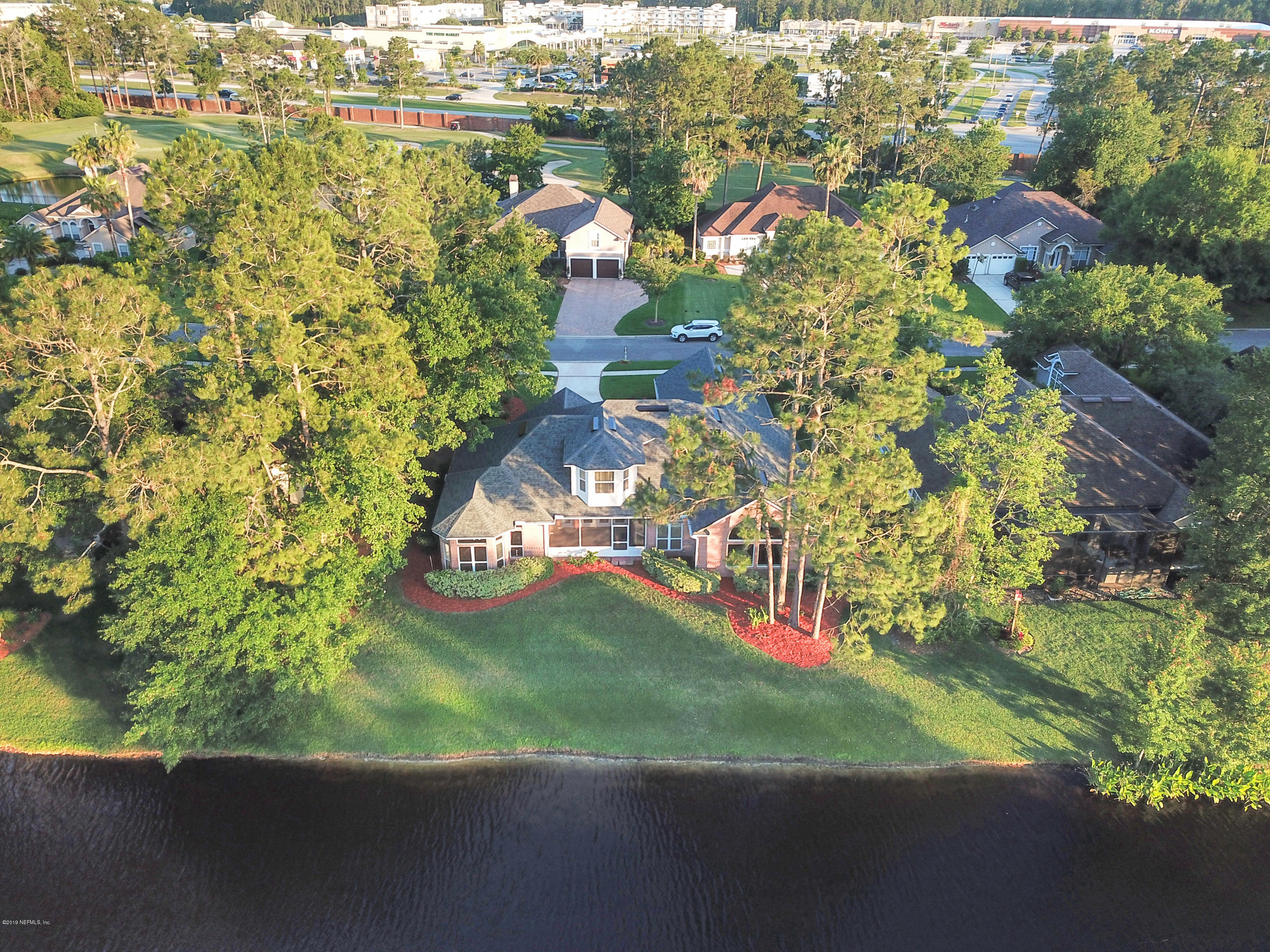 1444 Course View Drive Fleming Island, FL 32003 - Photo 50 of 61 an aerial view of residential houses with outdoor space and trees