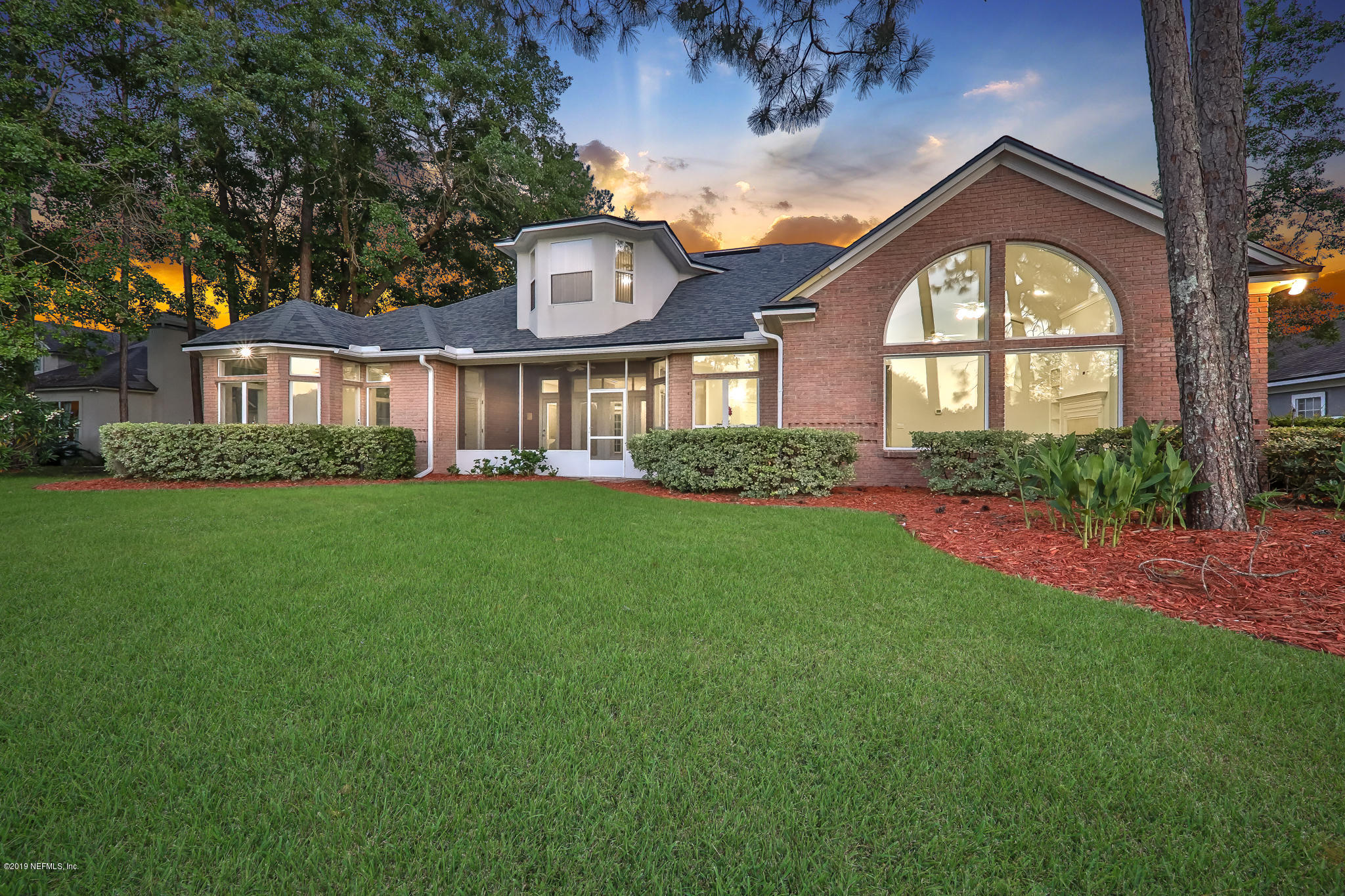 1444 Course View Drive Fleming Island, FL 32003 - Photo 5 of 61 a front view of a house with a garden