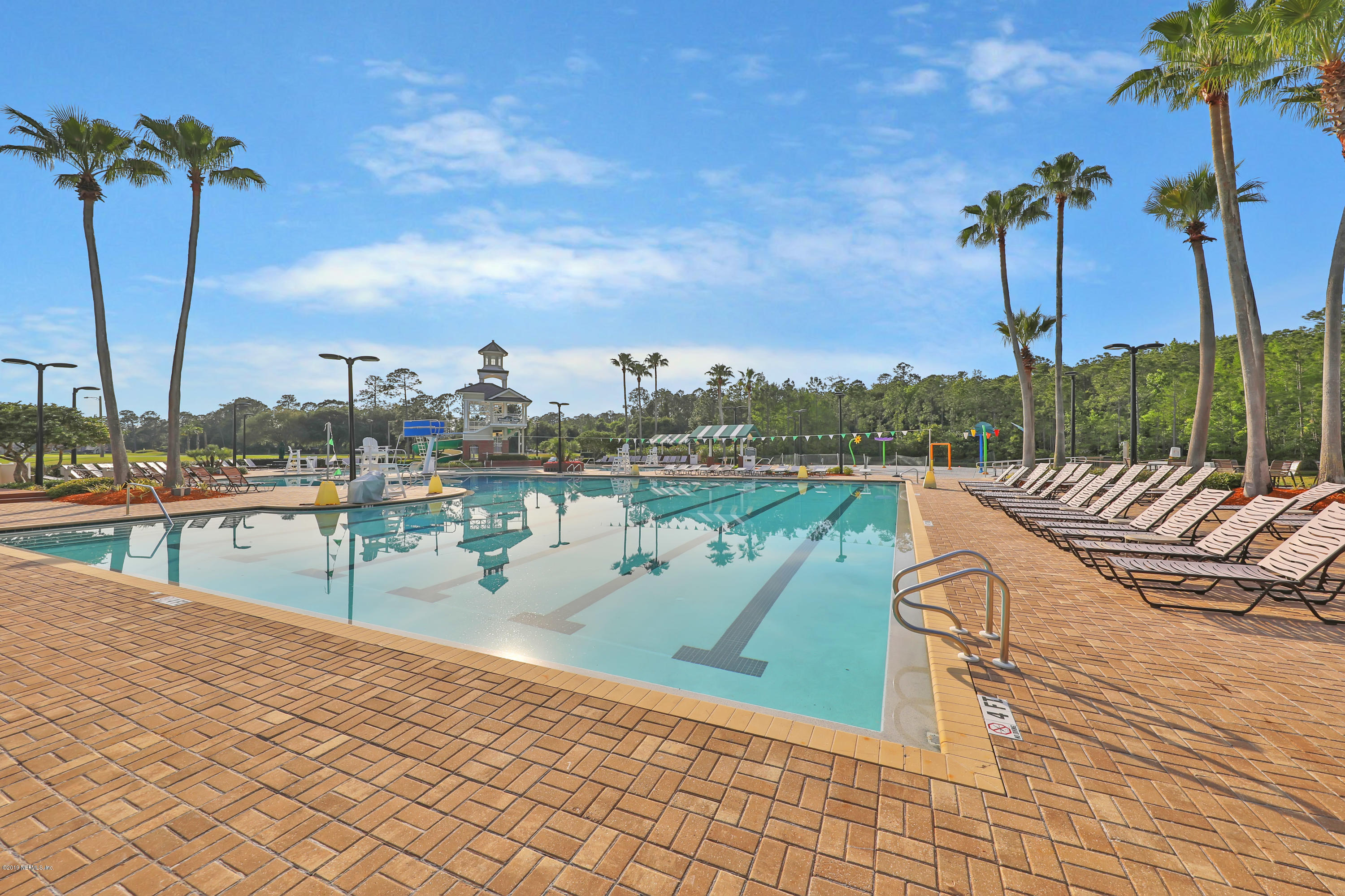 1444 Course View Drive Fleming Island, FL 32003 - Photo 51 of 61 a view of a lake with a table and chairs