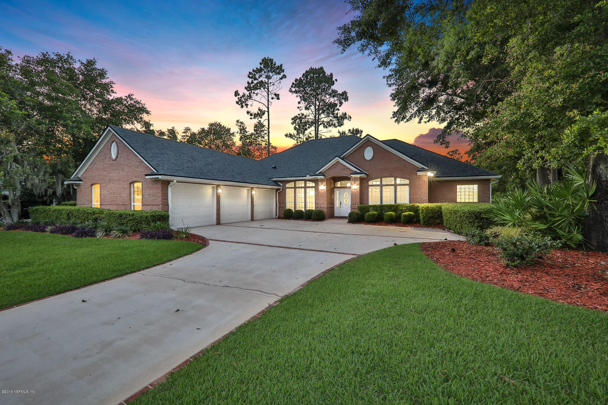 1444 Course View Drive Fleming Island, FL 32003 - Photo 7 of 61 a front view of a house with a garden