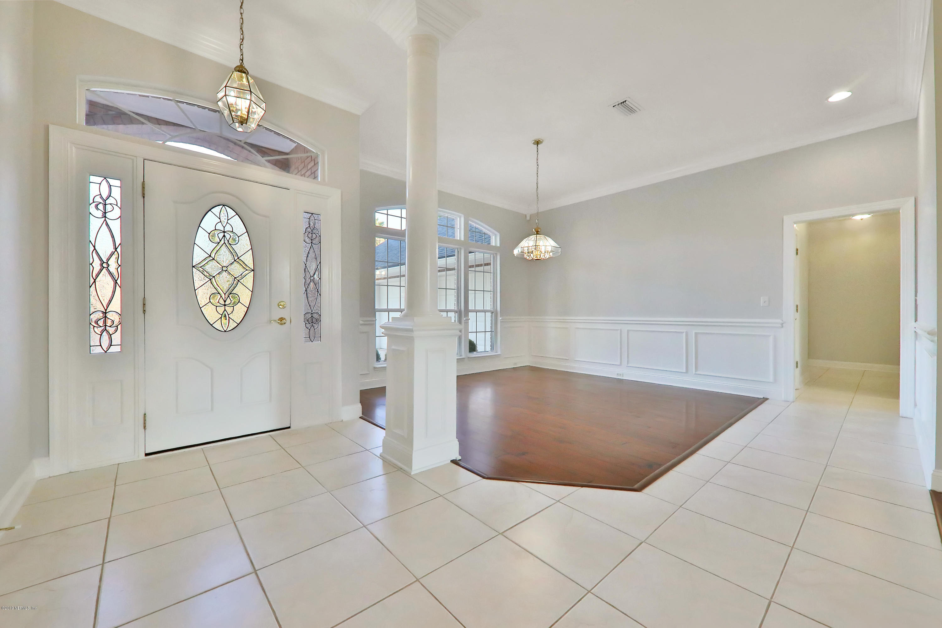 1444 Course View Drive Fleming Island, FL 32003 - Photo 8 of 61 a view of an entryway with a chandelier