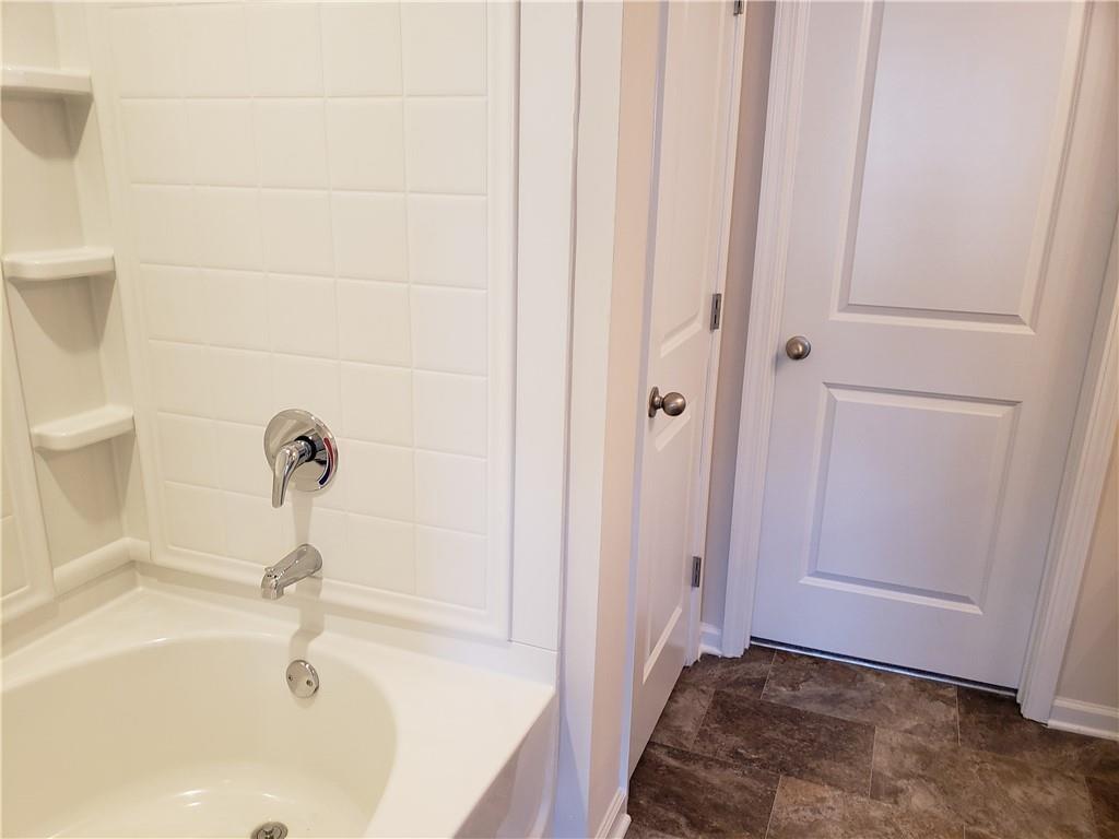 2725 Daybreak Court Suwanee, GA 30024 - Photo 11 of 17 a bathroom with a bathtub
