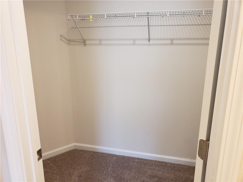 2725 Daybreak Court Suwanee, GA 30024 - Photo 13 of 17 a view of a room with racks on the wall