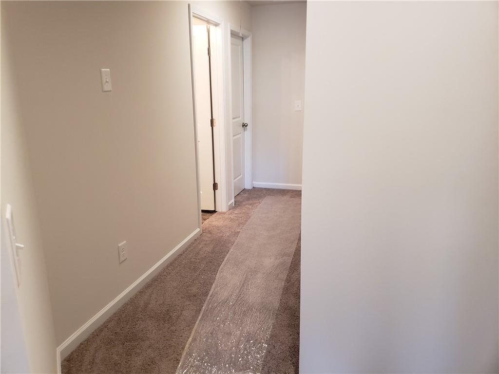 2725 Daybreak Court Suwanee, GA 30024 - Photo 14 of 17 a view of a room with wooden floor