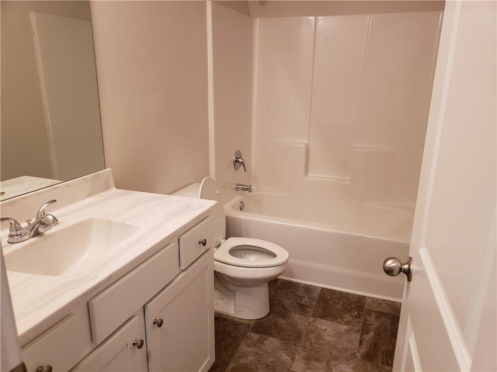 2725 Daybreak Court Suwanee, GA 30024 - Photo 15 of 17 a bathroom with a sink a toilet and shower