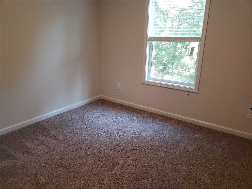 2725 Daybreak Court Suwanee, GA 30024 - Photo 16 of 17 an empty room with a window