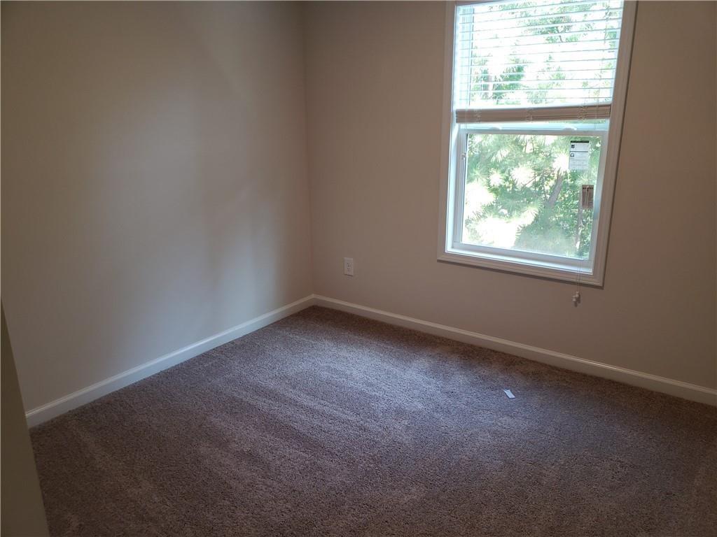 2725 Daybreak Court Suwanee, GA 30024 - Photo 17 of 17 an empty room with a window