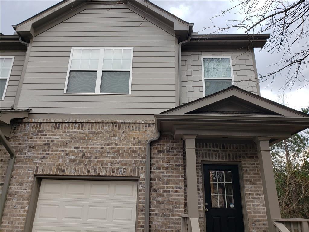 2725 Daybreak Court Suwanee, GA 30024 - Photo 2 of 17 a front view of a house with garage