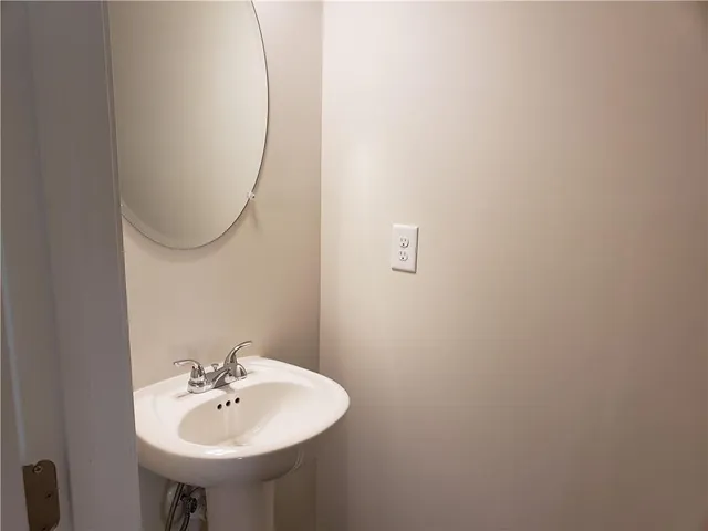 a view of entryway and gallery with wooden floor