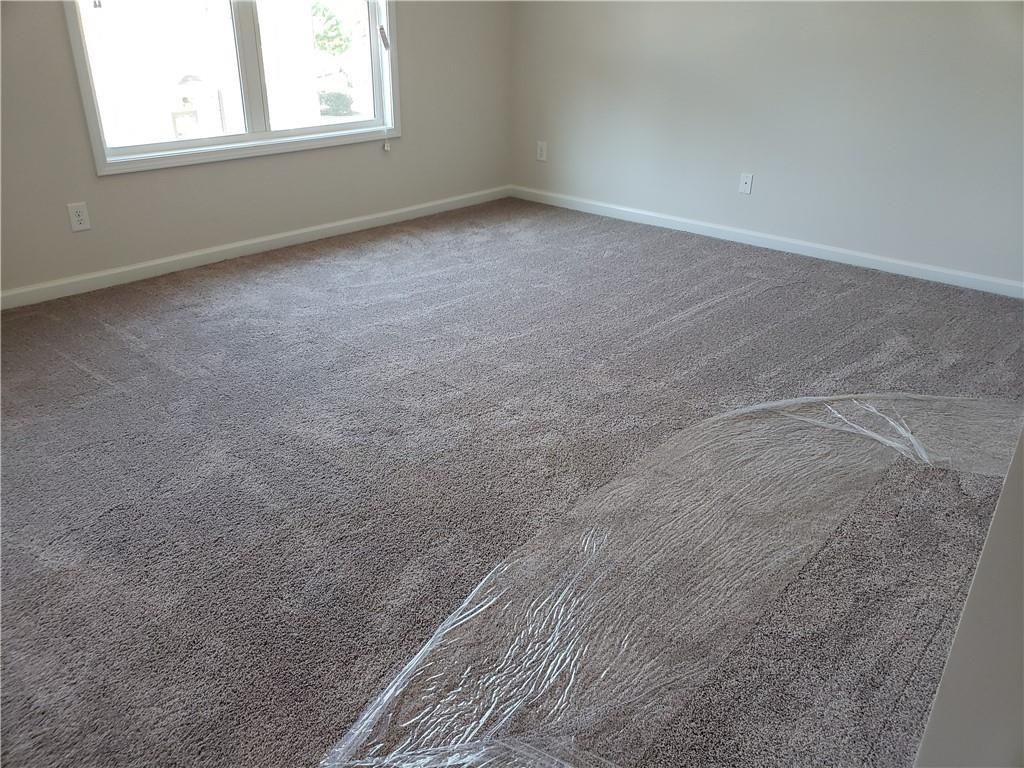 2725 Daybreak Court Suwanee, GA 30024 - Photo 9 of 17 an empty room with a window