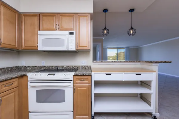 a kitchen with a stove and a microwave