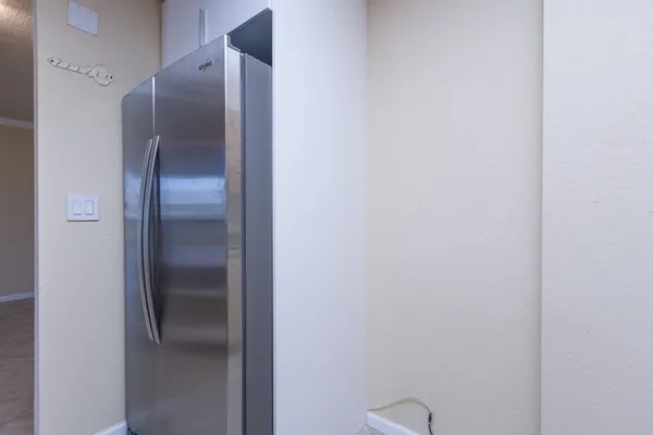 a metallic refrigerator in a kitchen