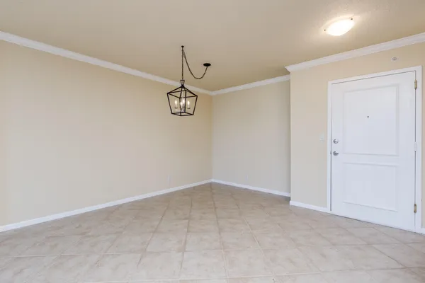 an empty room with a empty space and windows