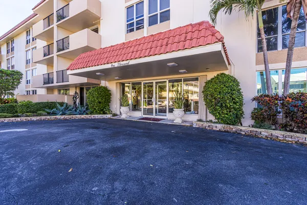 a view of a building with a garden