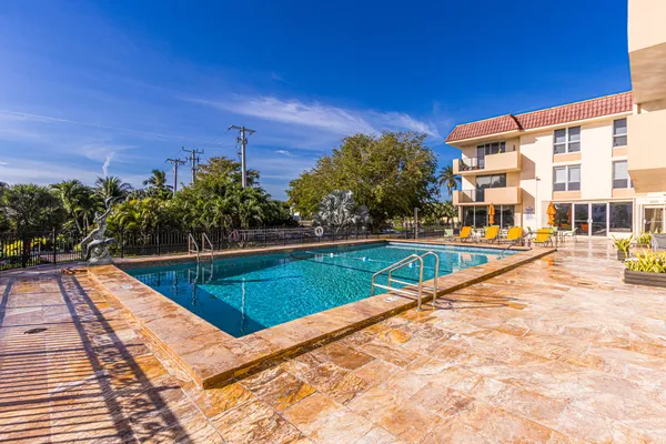 a view of swimming pool with a lounge chair