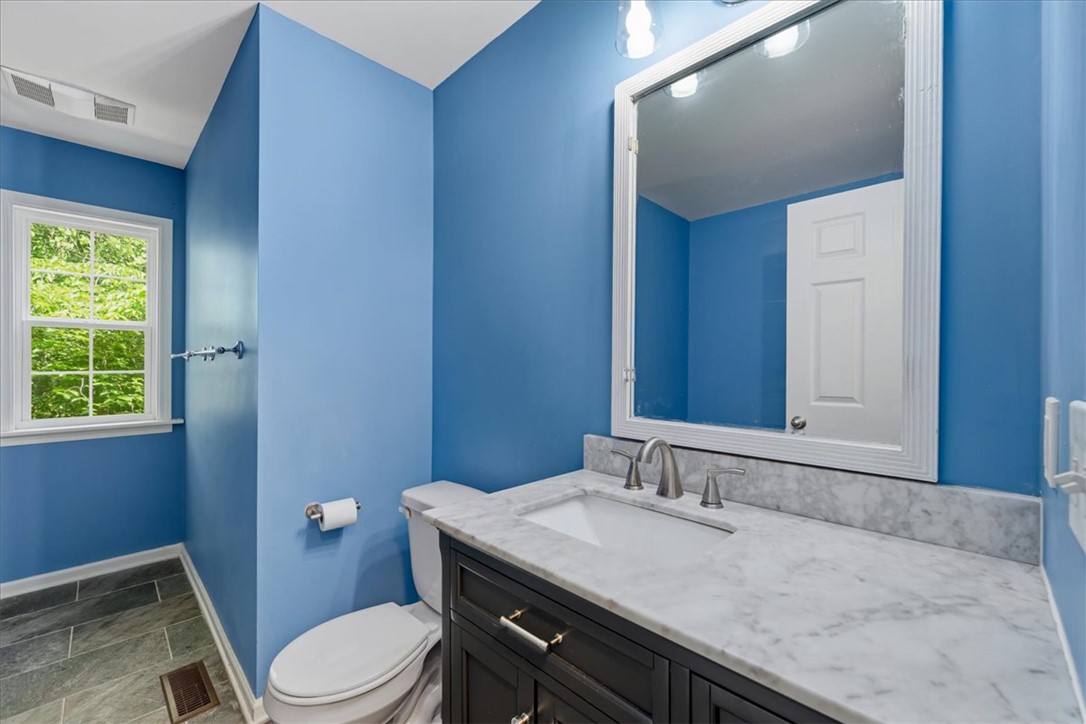 210 Briarcliff Road Central, SC 29630 - Photo 17 of 39 This bathroom features elegant granite counters, setting a refined tone for daily routines.