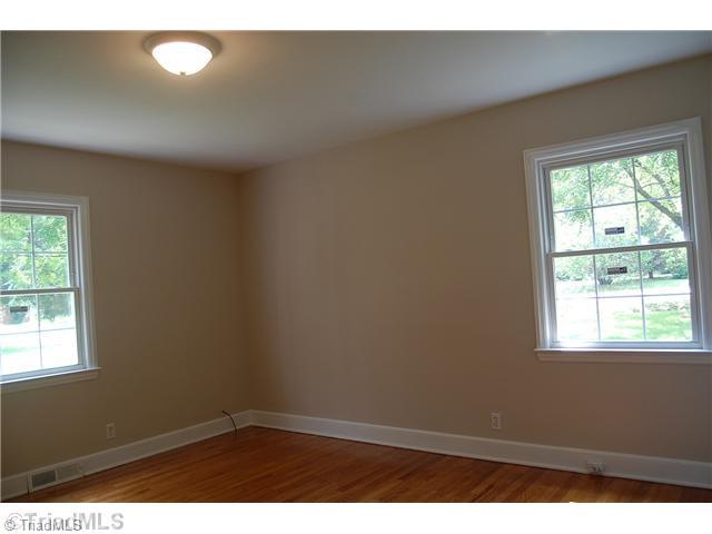 401 Lindley Road Greensboro, NC 27410 - Photo 11 of 16 Master Bedroom. The home has three bedrooms, the master with a private adjoining full bath.