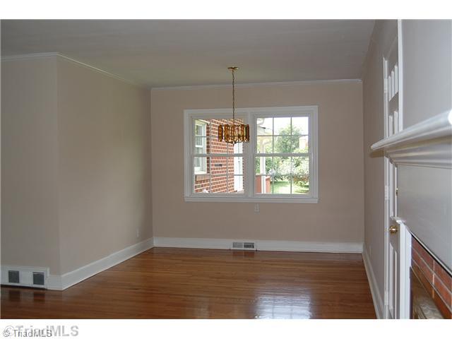 401 Lindley Road Greensboro, NC 27410 - Photo 6 of 16 Dining Room. The formal dining room adjoins the living room. The gleaming floors, neutral freshly painted walls and white moldings carry throughout the pristine home...all in ideal move-in condition.