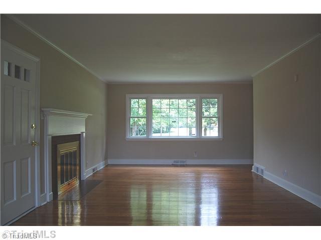 401 Lindley Road Greensboro, NC 27410 - Photo 7 of 16 Living Room. The living room and dining room areas are completely open to each other, offering a sense of huge spaciousness.