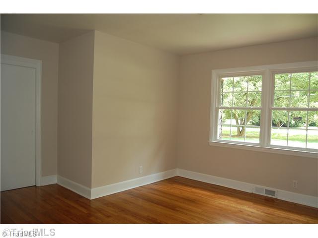401 Lindley Road Greensboro, NC 27410 - Photo 10 of 16 2nd Bedroom. Each room of the house boasts new windows, refinished floors, and have been professionally painted. Prestine, neutral and beautiful.