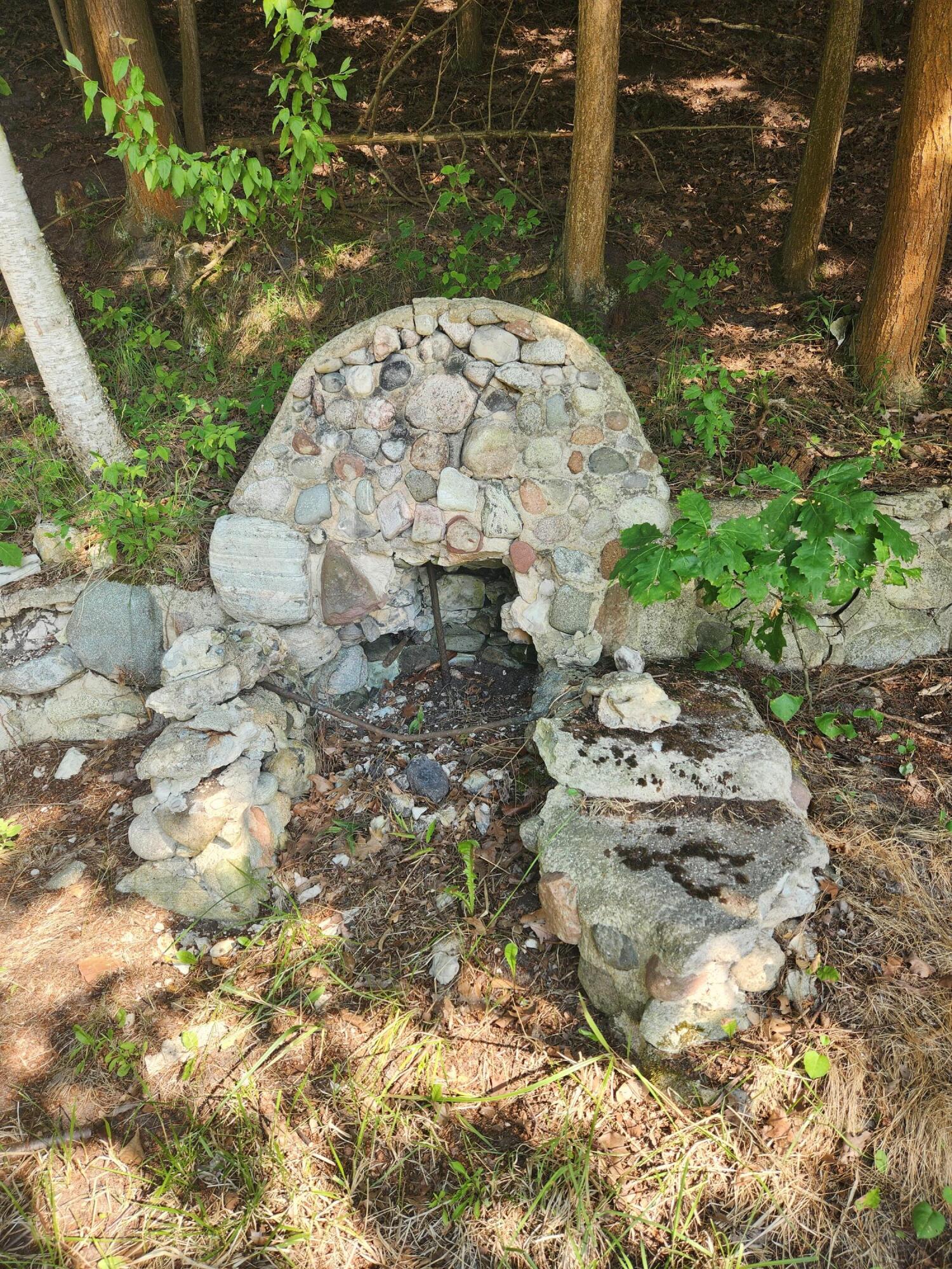 5341 North Benson Road Fountain, MI 49410 - Photo 14 of 24 Stone fireplace by water