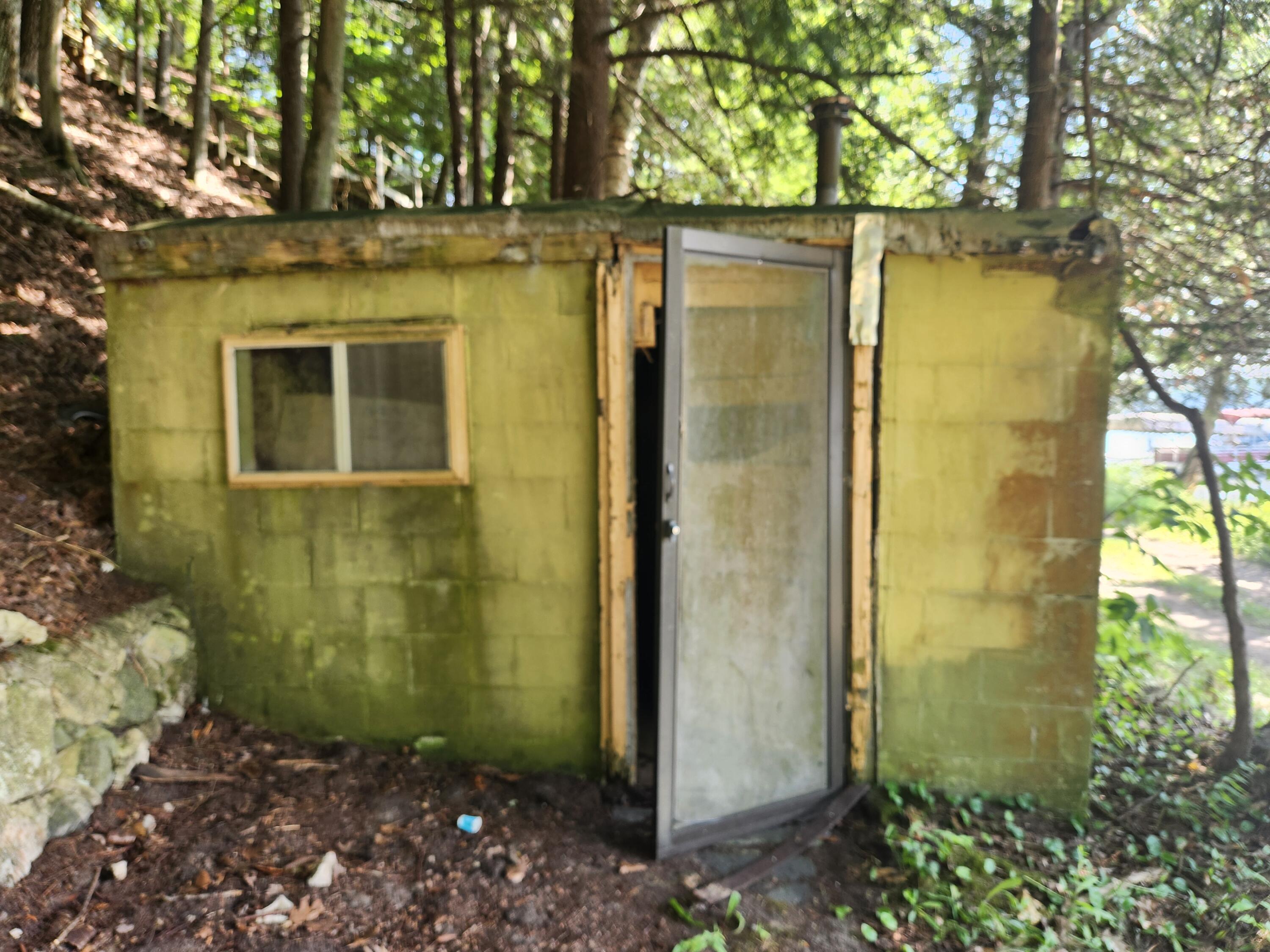 5341 North Benson Road Fountain, MI 49410 - Photo 19 of 24 Brick building by water