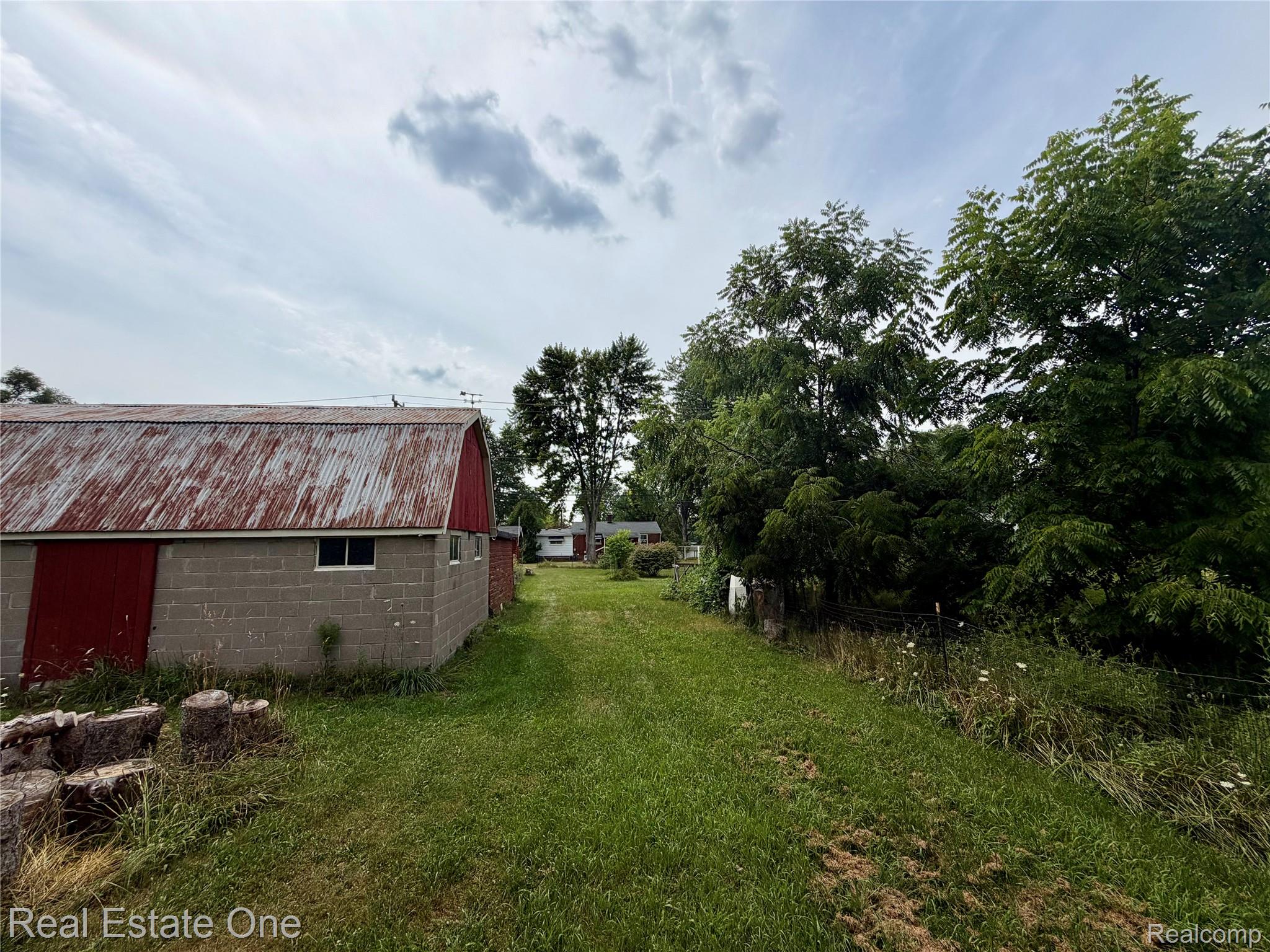 4985 Denton Road Canton, MI 48188 - Photo 16 of 37 Barn structure featuring a corrugated metal roof and concrete block walls