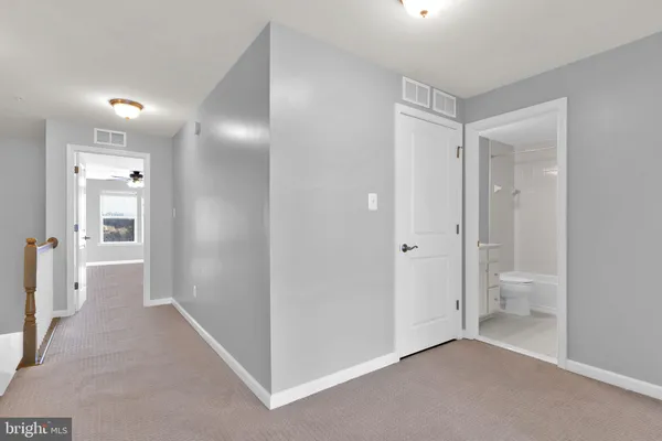 a view of a bathroom with a shower and a toilet