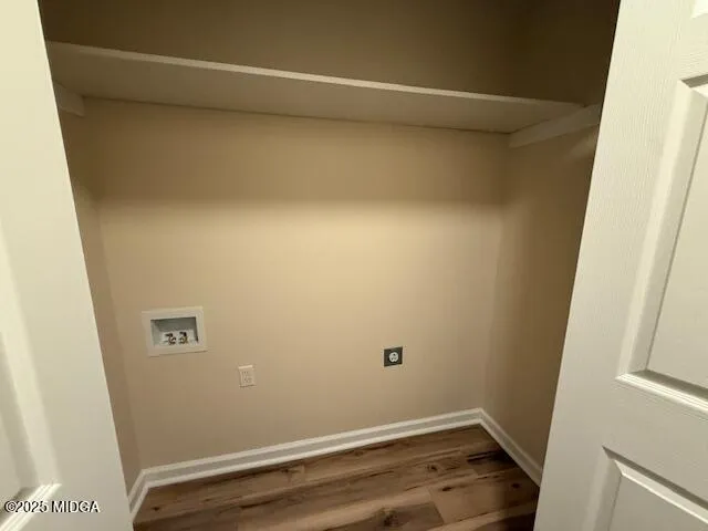 a large tree in front of a white house