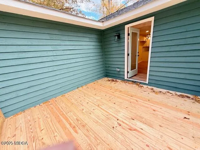 a view of backyard with small cabin and wooden fence