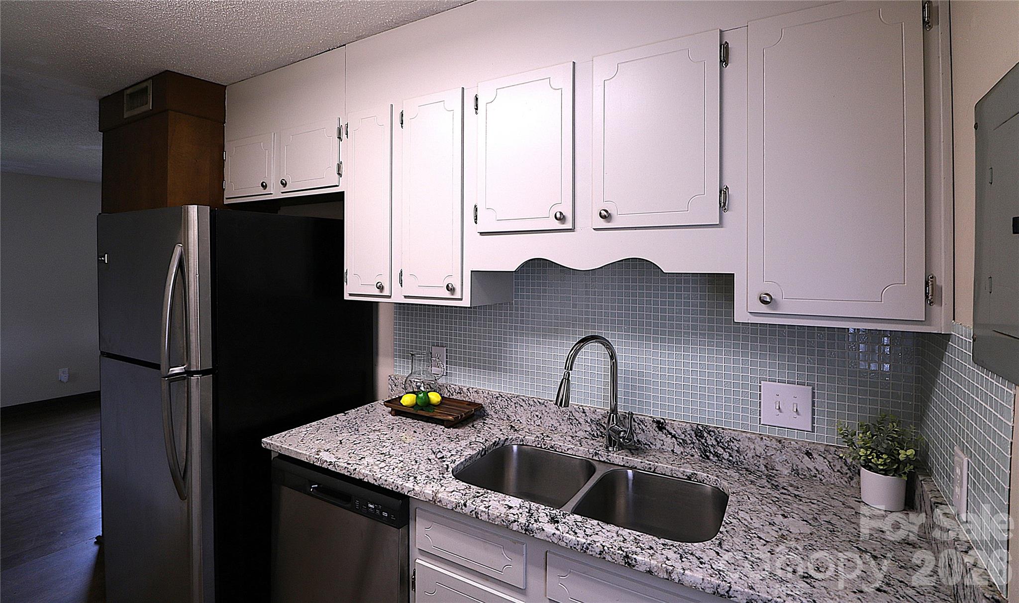 525 Southwest 12th Street Southwest, Unit 29 Hickory, NC 28602 - Photo 14 of 20 a kitchen with stainless steel appliances granite countertop a sink stove and refrigerator