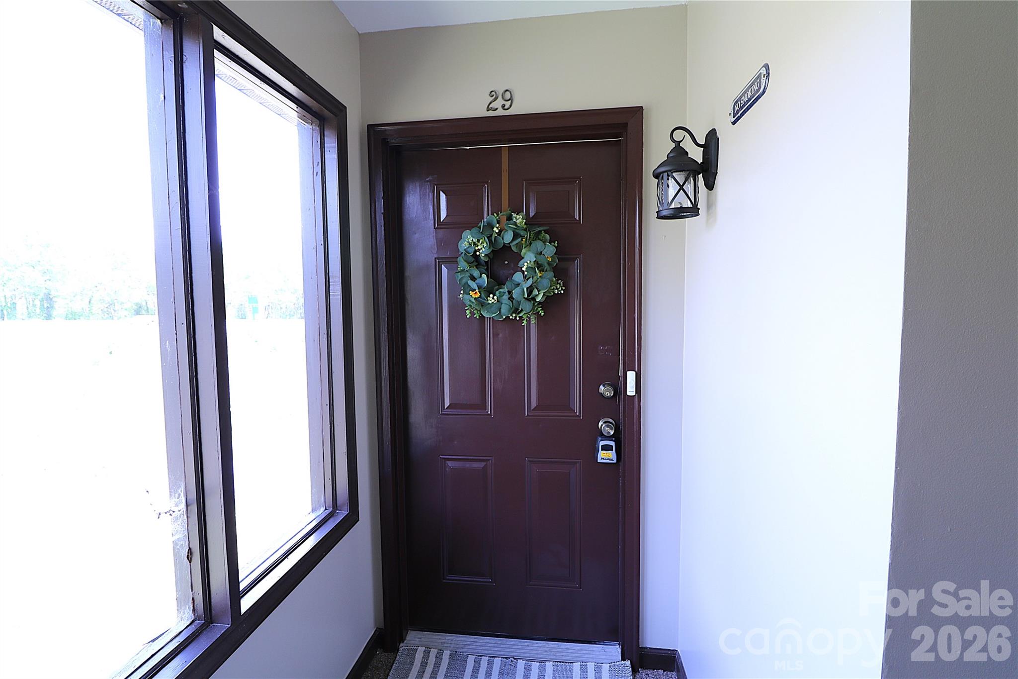 525 Southwest 12th Street Southwest, Unit 29 Hickory, NC 28602 - Photo 17 of 20 a view of a hallway with wooden floor and a potted plant