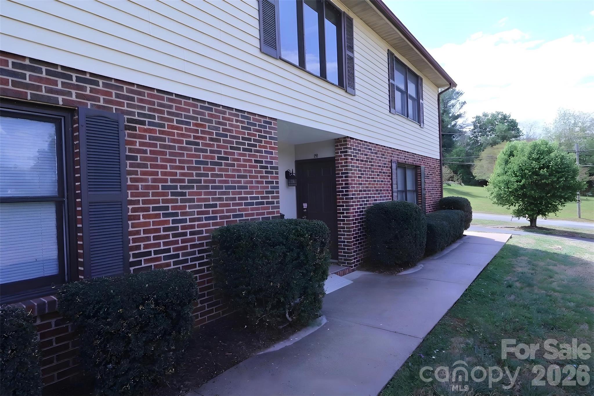 525 Southwest 12th Street Southwest, Unit 29 Hickory, NC 28602 - Photo 19 of 20 a view of a house with a yard and a chair