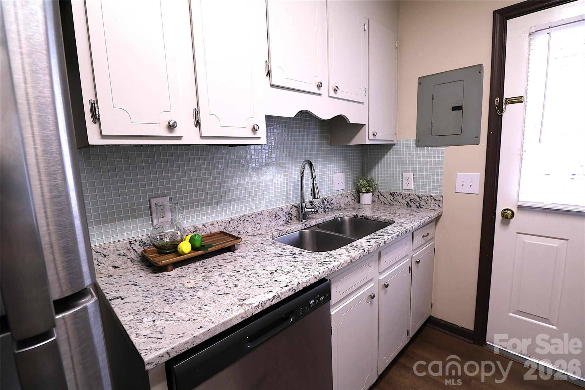 525 Southwest 12th Street Southwest, Unit 29 Hickory, NC 28602 - Photo 4 of 20 a kitchen with stainless steel appliances granite countertop a sink stove and cabinets