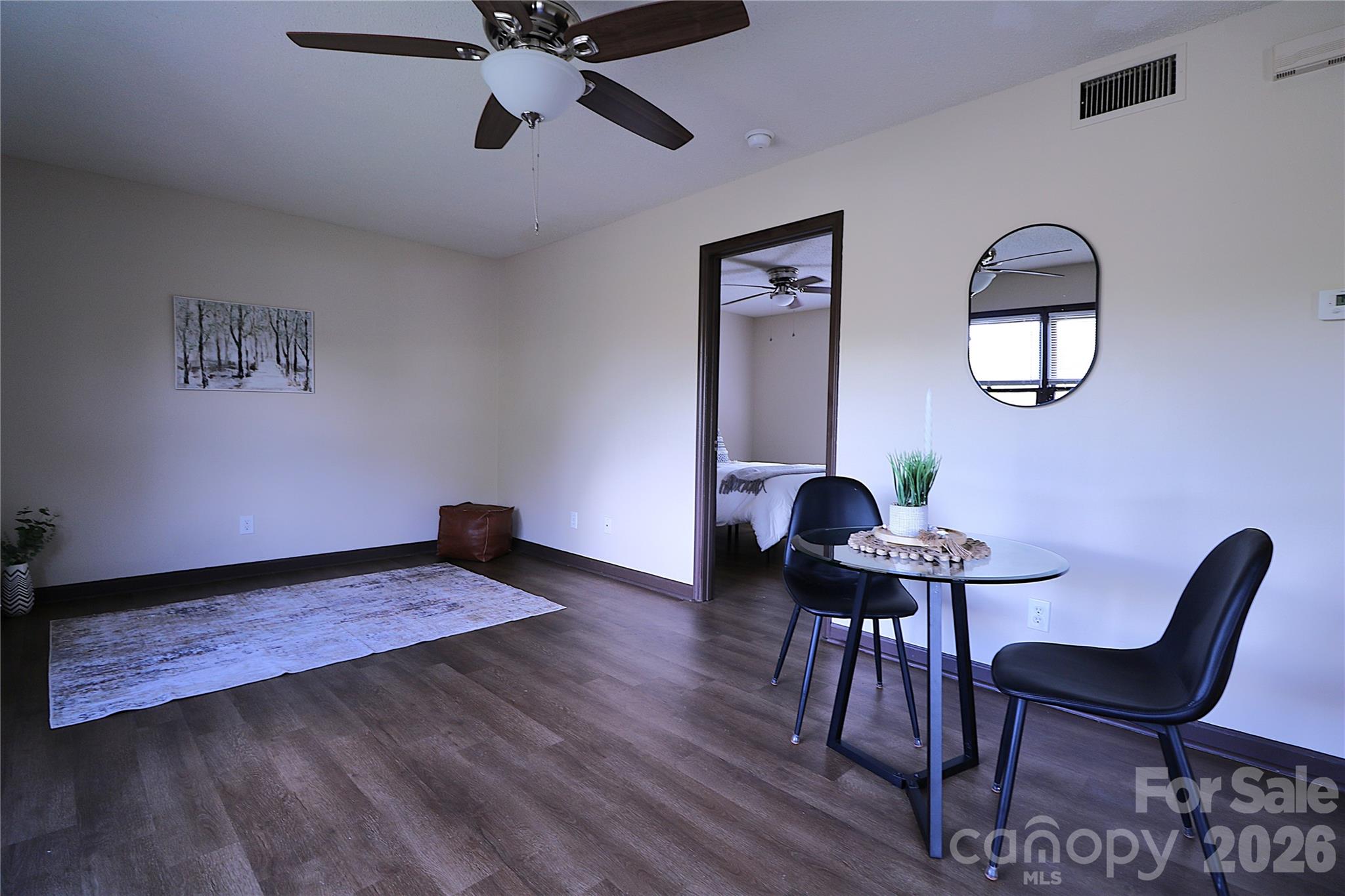 525 Southwest 12th Street Southwest, Unit 29 Hickory, NC 28602 - Photo 6 of 20 a view of a workspace with furniture and wooden floor