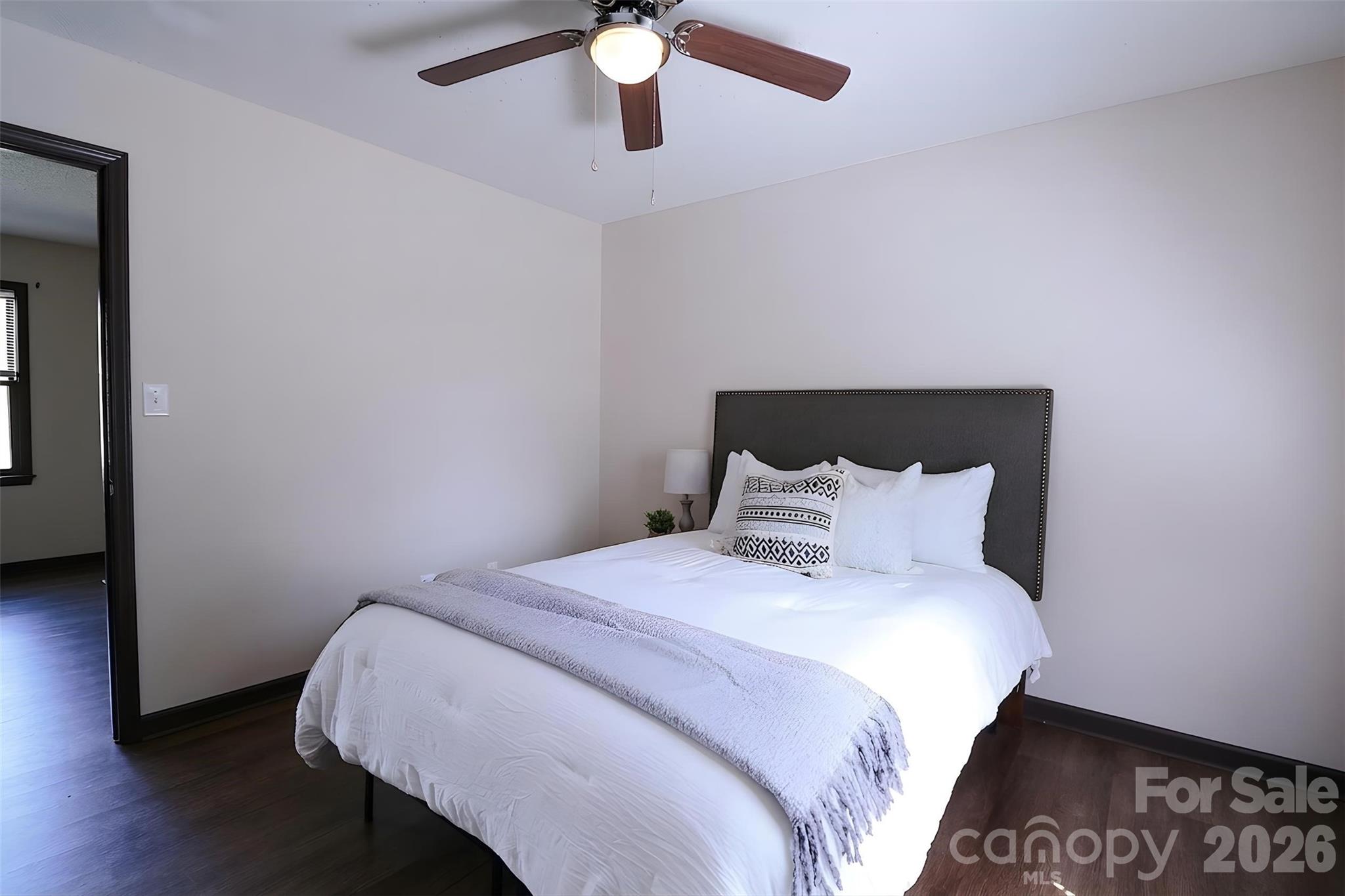 525 Southwest 12th Street Southwest, Unit 29 Hickory, NC 28602 - Photo 9 of 20 a bedroom with a bed and wooden floor