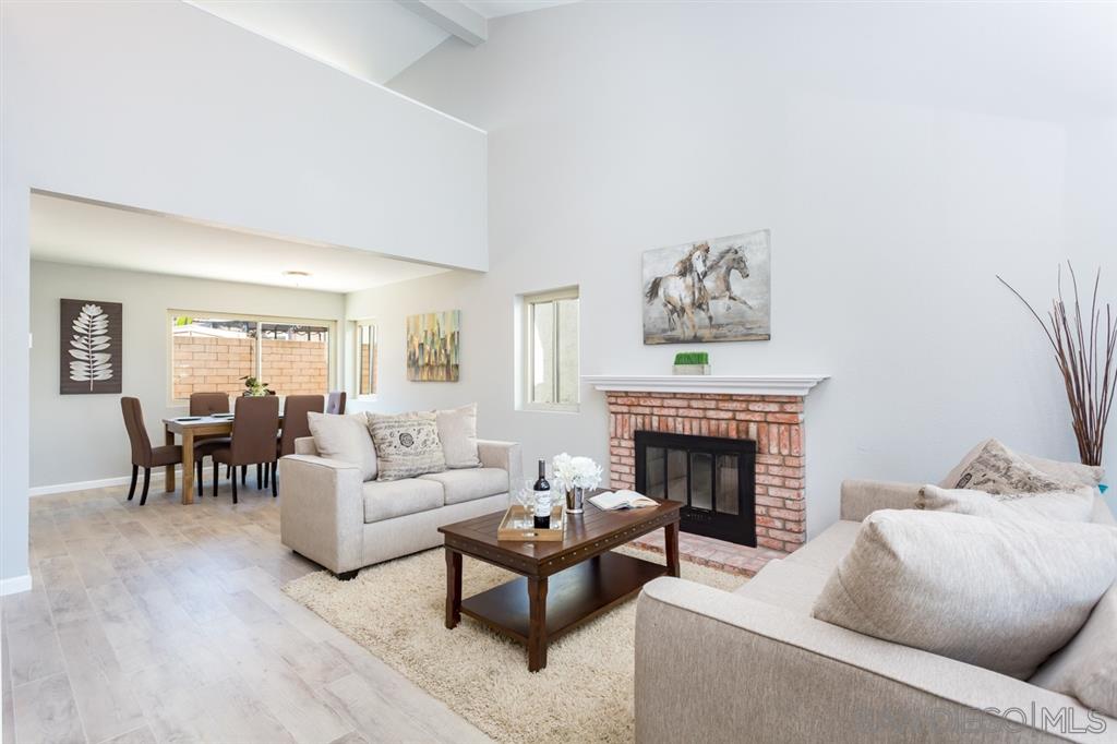 265 Argus Way Oceanside, CA 92057 - Photo 2 of 24 a living room with furniture and a fireplace