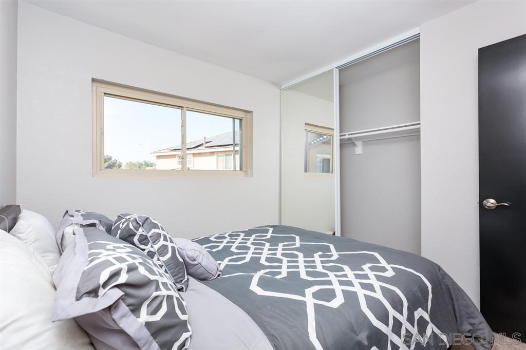265 Argus Way Oceanside, CA 92057 - Photo 22 of 24 a bedroom with a bed and a window