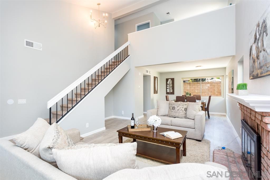 265 Argus Way Oceanside, CA 92057 - Photo 3 of 24 a living room with furniture and a dining table