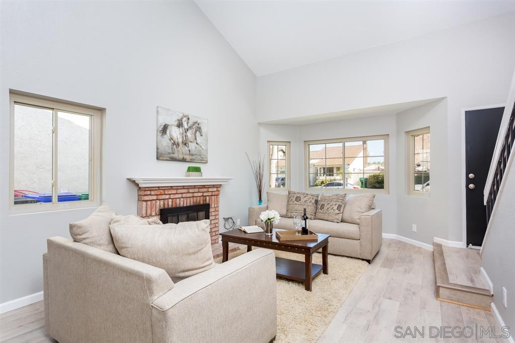 265 Argus Way Oceanside, CA 92057 - Photo 4 of 24 a living room with furniture and a fireplace